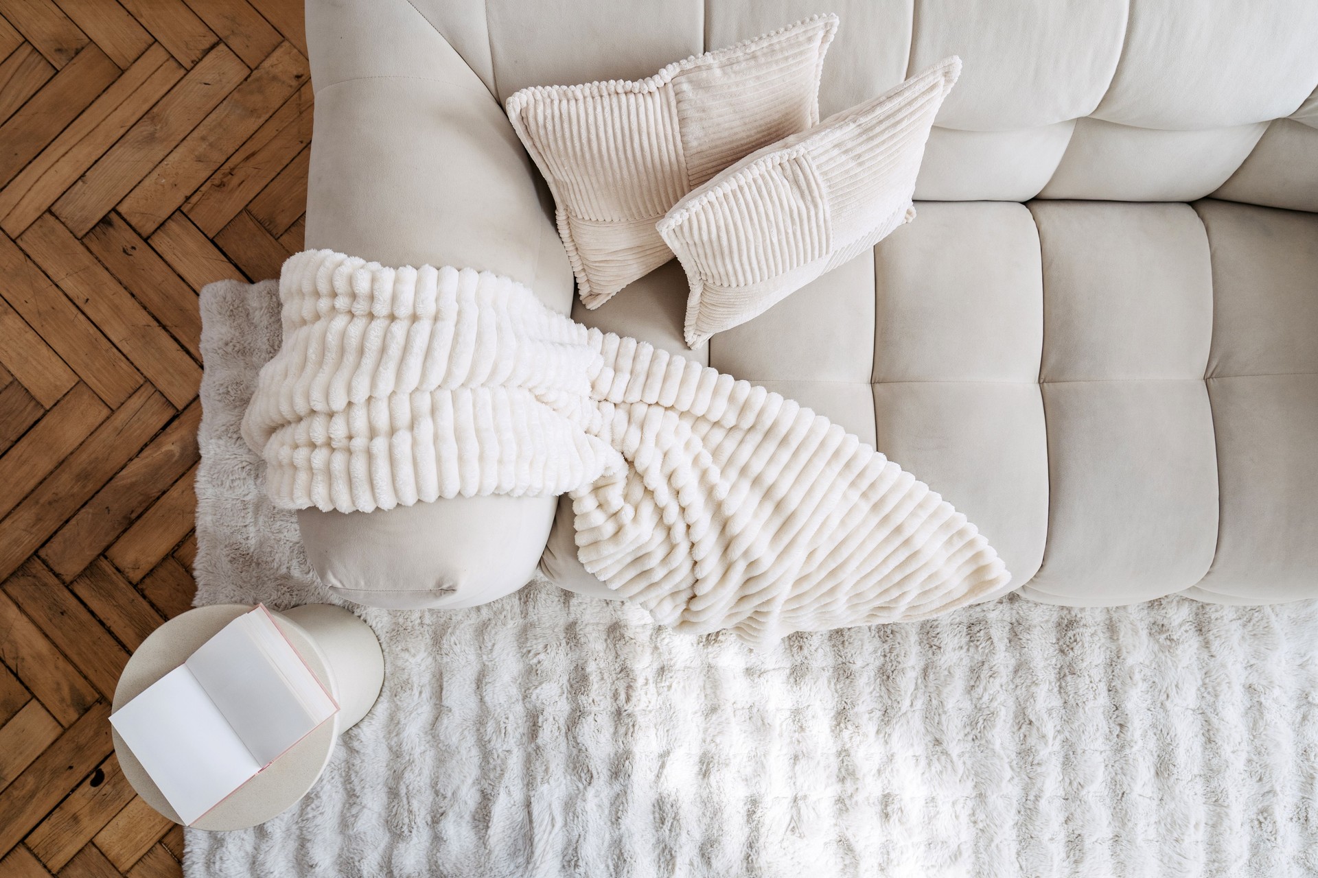 Cozy white modern interior featuring a comfortable couch with elegant decor elements